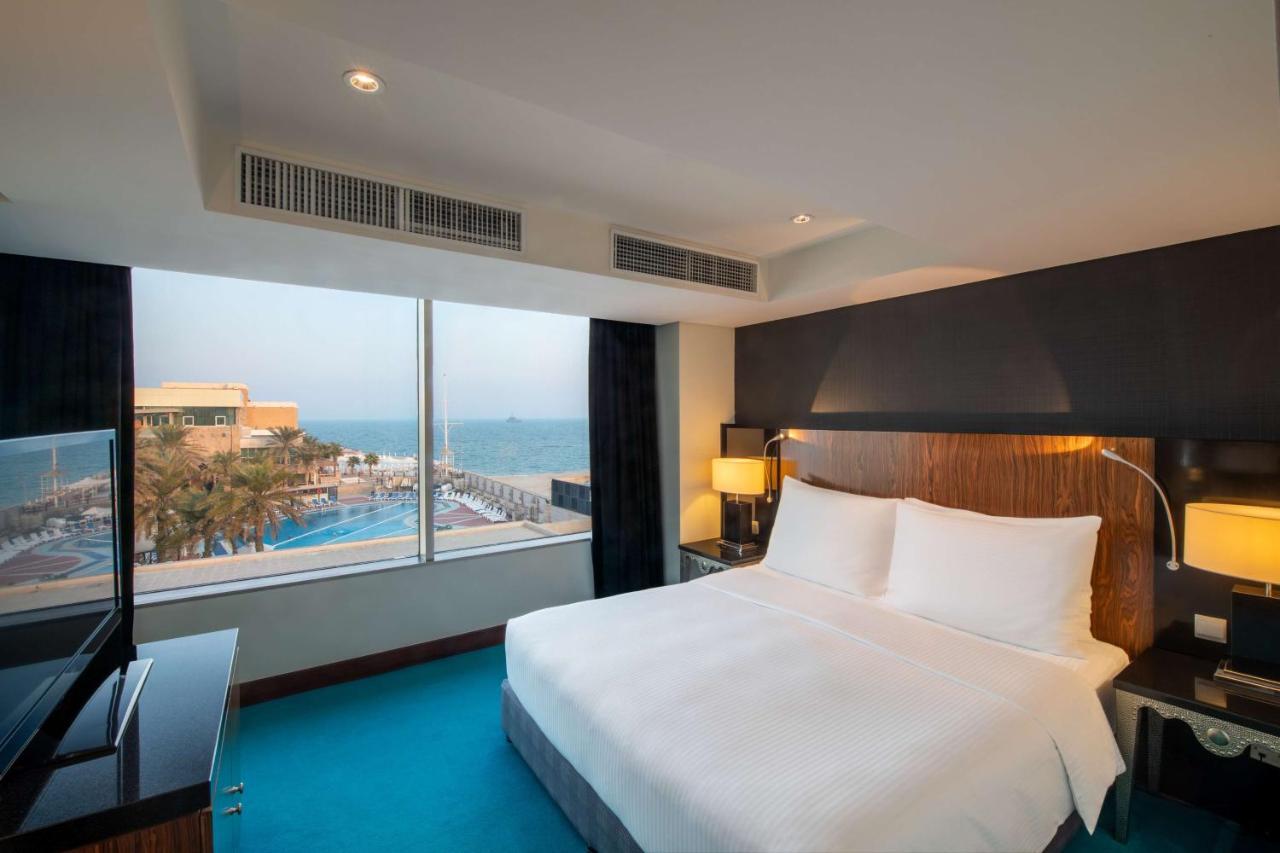 Radisson Blu Hotel, Kuwait Кувейт Экстерьер фото A bedroom at the Hilton Tel Aviv